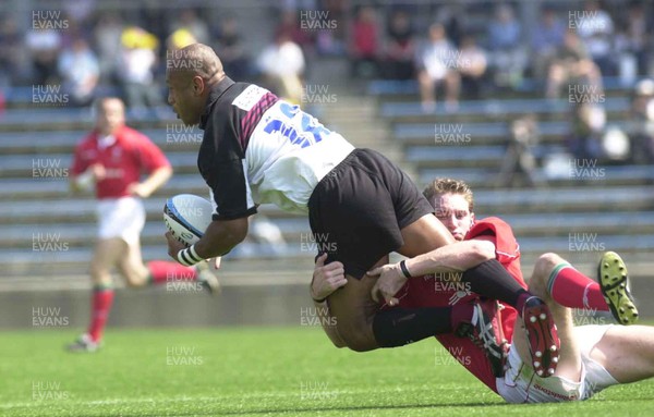 030601 - Suntory v Wales - Jamie Robinson gets to grips with Alfred Uluinayau
