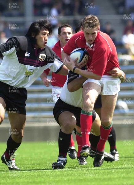 030601 - Suntory v Wales - Jamie Robinson is tackled by Kazunaka Motoyoshi