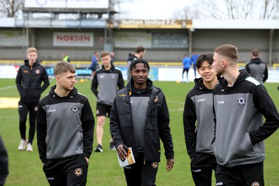 010124 - Sutton United v Newport County - Sky Bet League 2 - Newport players inspect the pitch on arrival