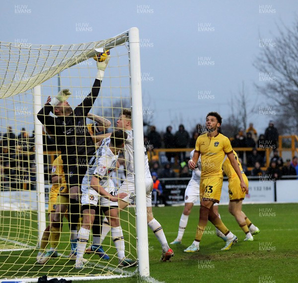 010124 - Sutton United v Newport County - Sky Bet League 2 - Dean Bouzanis of Sutton United saves on to the crossbar