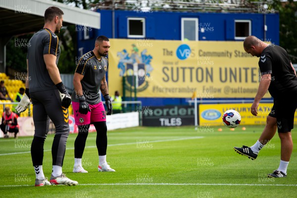 300722 - Sutton United v Newport County - Sky Bet League 2 - Joe Day of Newport County and Nick Townsend of Newport County warm up