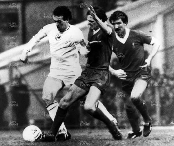 02.01.82 - Swansea City v Liverpool. Swansea's Alan Curtis avoids Phil Thompson and Graeme Souness. 