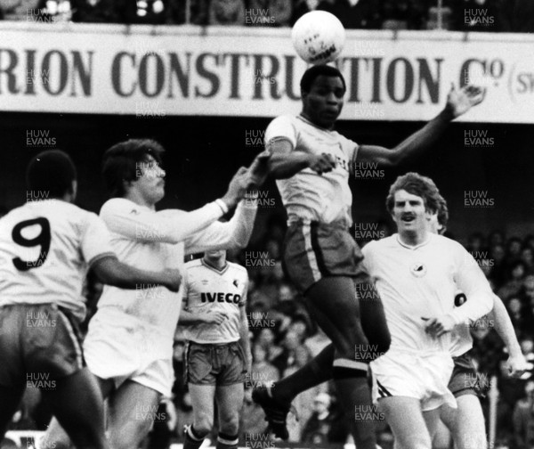 06.02.83 - Swansea City v watford. Luther Blisset heads the ball between Jeremy Charles and Robbie James. 