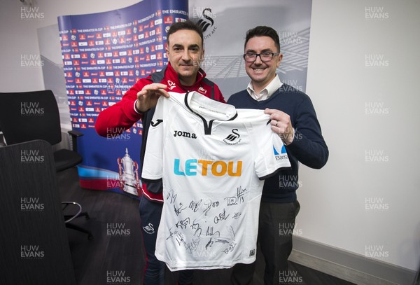 150218 - Swansea City Press Conference - Swansea City manager Carlos Carvalhal presents a signed shirt to WalesOnline chief football writer Chris Wathan