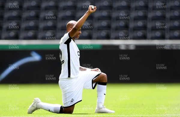 050720 - Swansea City v Sheffield Wednesday - SkyBet Championship - Andre Ayew of Swansea City takes a knee at kick off