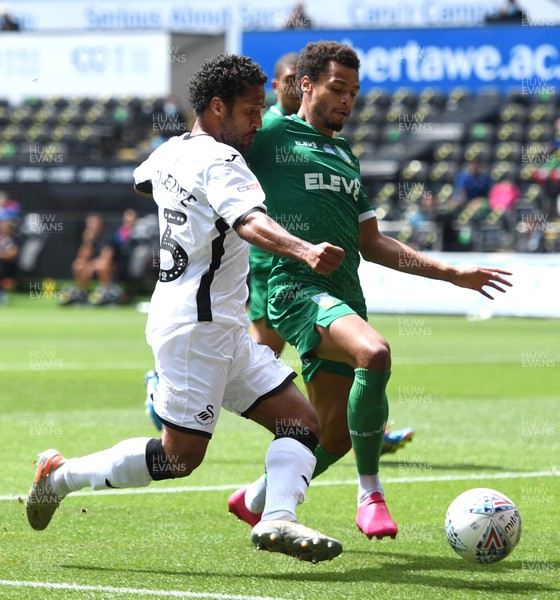 050720 - Swansea City v Sheffield Wednesday - SkyBet Championship - Wayne Routledge of Swansea City tries to get past Jacob Murphy of Sheffield Wednesday
