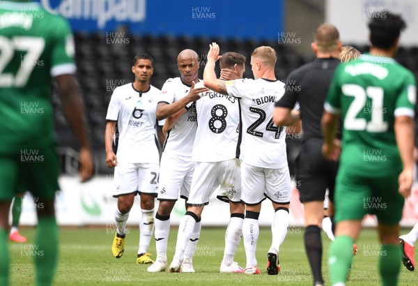 050720 - Swansea City v Sheffield Wednesday - SkyBet Championship - Andre Ayew of Swansea City celebrates scoring goal with Matt Grimes and Ben Wilmot