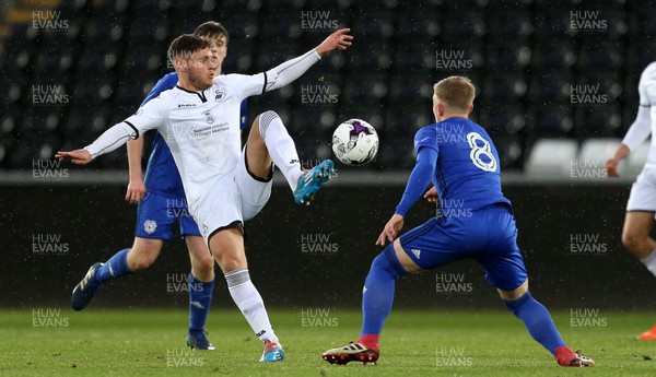 010518 - Swansea City U19s v Cardiff City U19s - FAW Youth Cup Final - Kieran Evans of Swansea is challenged by Laurence Wootton of Cardiff