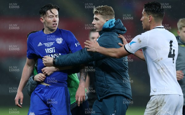 010518 - Swansea City U19s v Cardiff City U19s - FAW Youth Cup Final - Cameron Coxe of Cardiff is dragged away after trouble between the teams at full time