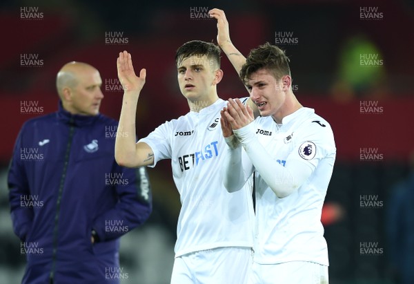 240117 - Swansea City Under 21s v Coventry - Checkatrade Trophy - Keston Davies and Adnan Maric of Swansea City look dejected at the end of the game