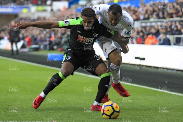 251117 - Swansea City v AFC Bournemouth, Premier League - Jordan Ayew of Swansea City (right) and Jordon Ibe of AFC Bournemouth battle for the ball