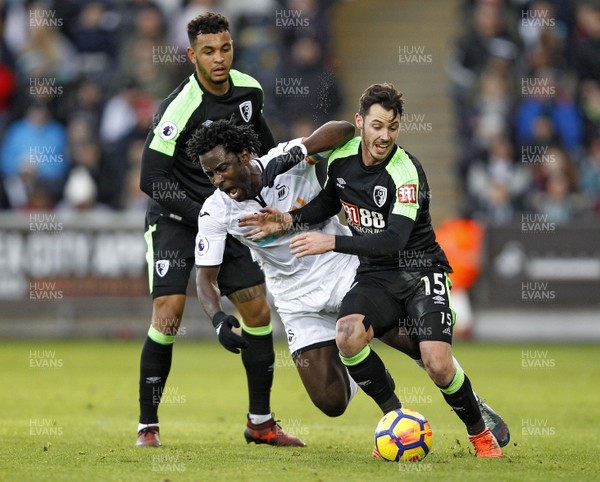 251117 - Swansea City v AFC Bournemouth, Premier League - Wilfried Bony of Swansea City (centre) in action with Adam Smith of AFC Bournemouth (right) 