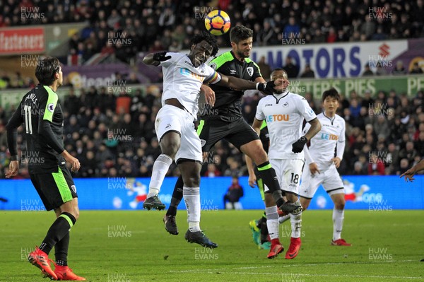 251117 - Swansea City v AFC Bournemouth, Premier League - Wilfried Bony of Swansea City (left) and Andrew Surman of AFC Bournemouth battle for the ball