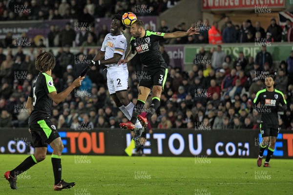 251117 - Swansea City v AFC Bournemouth, Premier League - Wilfried Bony of Swansea City (left) and Steve Cook of AFC Bournemouth battle for the ball