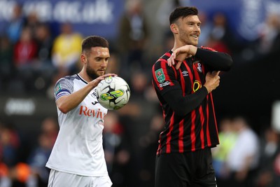 290823 - Swansea City v AFC Bournemouth - Carabao Cup - Kieffer Moore of Bournemouth points at his elbow after Swansea win a penalty