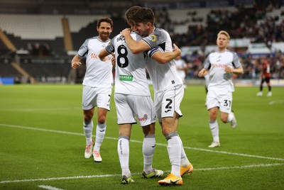 290823 - Swansea City v AFC Bournemouth - Carabao Cup - Matt Grimes of Swansea celebrates scoring a goal with team mates