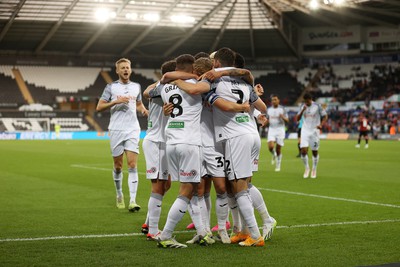 290823 - Swansea City v AFC Bournemouth - Carabao Cup - Matt Grimes of Swansea celebrates scoring a goal with team mates