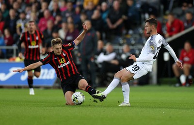 290823 - Swansea City v AFC Bournemouth - Carabao Cup - Liam Cullen of Swansea is tackled by David Brooks of Bournemouth 