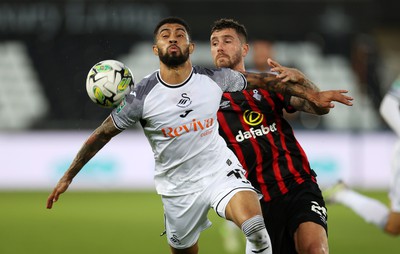 290823 - Swansea City v AFC Bournemouth - Carabao Cup - Josh Ginnelly of Swansea is challenged by Marcos Senesi of Bournemouth 