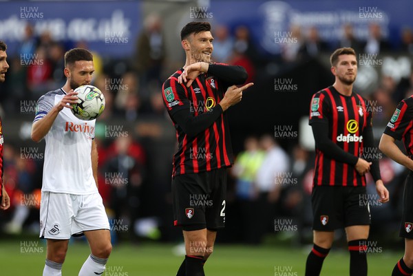 290823 - Swansea City v AFC Bournemouth - Carabao Cup - Kieffer Moore of Bournemouth points at his elbow after Swansea win a penalty