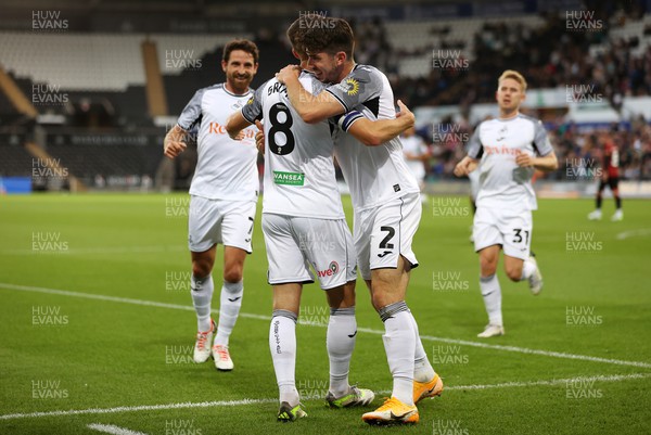 290823 - Swansea City v AFC Bournemouth - Carabao Cup - Matt Grimes of Swansea celebrates scoring a goal with team mates
