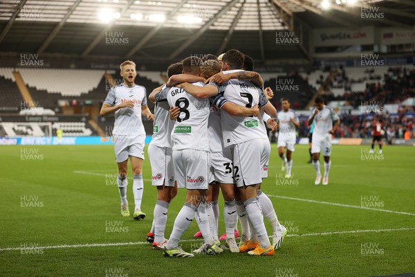 290823 - Swansea City v AFC Bournemouth - Carabao Cup - Matt Grimes of Swansea celebrates scoring a goal with team mates