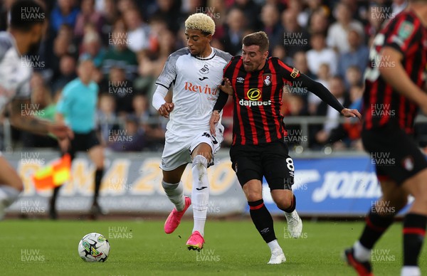 290823 - Swansea City v AFC Bournemouth - Carabao Cup - Azeem Abdulai of Swansea is challenged by Joe Rothwell of Bournemouth 