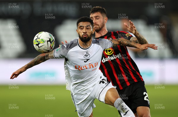 290823 - Swansea City v AFC Bournemouth - Carabao Cup - Josh Ginnelly of Swansea is challenged by Marcos Senesi of Bournemouth 