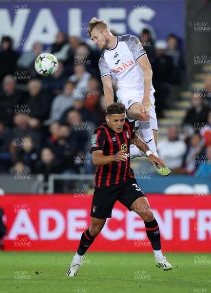 290823 - Swansea City v AFC Bournemouth - Carabao Cup - Harry Darling of Swansea gets above Max Aarons of Bournemouth 