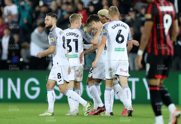 290823 - Swansea City v AFC Bournemouth - Carabao Cup - Jamie Paterson of Swansea celebrates scoring a goal with team mates