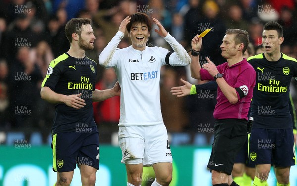 140117 - Swansea City v Arsenal - Premier League - Ki Sung-Yueng of Swansea City is given a yellow card, by Chris Fairweather/Huw Evans Agency