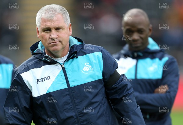 140117 - Swansea City v Arsenal - Premier League - Assistant Coach Nigel Gibbs and Swansea Coach Claude Makelele by Chris Fairweather/Huw Evans Agency