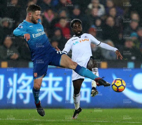 300118 - Swansea City v Arsenal - Premier League - Nathan Dyer of Swansea City is tackled by Shkodran Mustafi of Arsenal