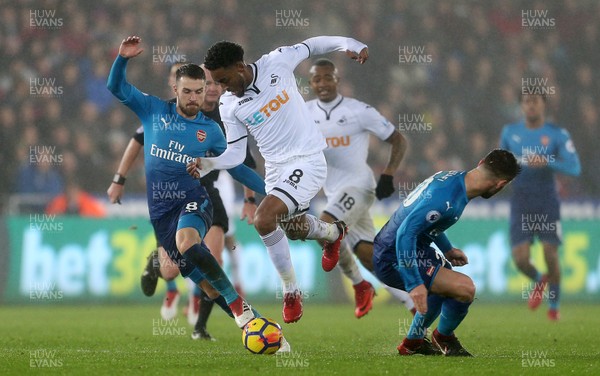 300118 - Swansea City v Arsenal - Premier League - Leroy Fer of Swansea City is challenged by Aaron Ramsey and Shkodran Mustafi of Arsenal