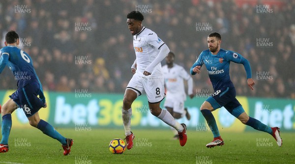 300118 - Swansea City v Arsenal - Premier League - Leroy Fer of Swansea City is challenged by Aaron Ramsey of Arsenal