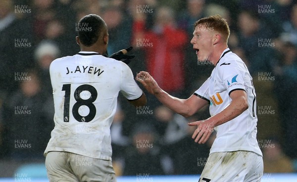 300118 - Swansea City v Arsenal - Premier League - Jordan Ayew of Swansea City celebrates scoring a goal with Sam Clucas