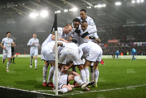 300118 - Swansea City v Arsenal - Premier League - Sam Clucas of Swansea City celebrates scoring a goal with team mates