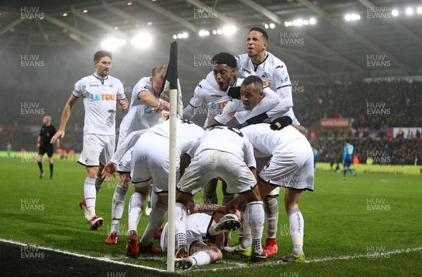 300118 - Swansea City v Arsenal - Premier League - Sam Clucas of Swansea City celebrates scoring a goal with team mates