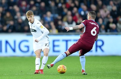 261218 - Swansea City v Aston Villa - SkyBet Championship - Jay Fulton of Swansea City is tackled by Glenn Whelan of Aston Villa