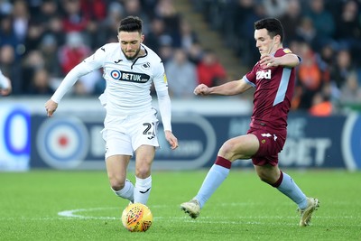 261218 - Swansea City v Aston Villa - SkyBet Championship - Matt Grimes of Swansea City is tackled by John McGinn of Aston Villa