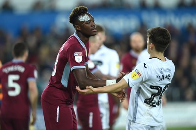 261218 - Swansea City v Aston Villa - SkyBet Championship - Tammy Abraham of Aston Villa and Daniel James of Swansea City after a tackle