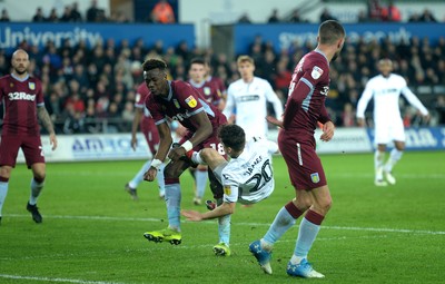 261218 - Swansea City v Aston Villa - SkyBet Championship - Daniel James of Swansea City is tackled by Tammy Abraham of Aston Villa