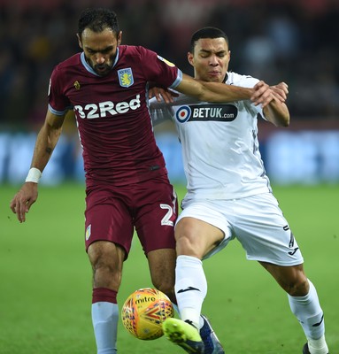 261218 - Swansea City v Aston Villa - SkyBet Championship - Ahmed Elmohamady of Aston Villa and Jefferson Montero of Swansea City compete