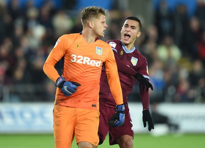 261218 - Swansea City v Aston Villa - SkyBet Championship - Orjan Nyland and Anwar El Ghazi of Aston Villa celebrate saving Wilfried Bony of Swansea City shot