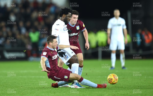 261218 - Swansea City v Aston Villa - SkyBet Championship - Wilfried Bony of Swansea City is tackled by James Chester of Aston Villa