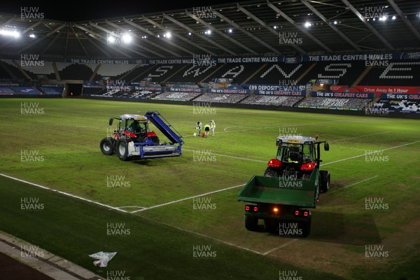 191220 - Swansea City v Barnsley - SkyBet Championship - Tractors move onto the pitch after the game
