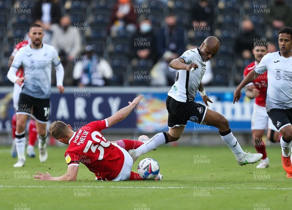220521 - Swansea City v Barnsley, Sky Bet Championship Play Off Semi Final, Second Leg - Andre Ayew of Swansea City wins the ball from Michal Helik of Barnsley