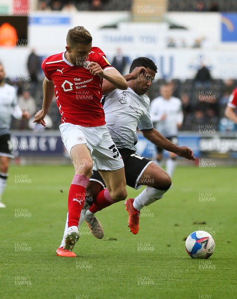 220521 - Swansea City v Barnsley, Sky Bet Championship Play Off Semi Final, Second Leg - Wayne Routledge of Swansea City and Michal Helik of Barnsley compete for the ball