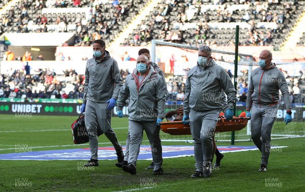 220521 - Swansea City v Barnsley, Sky Bet Championship Play Off Semi Final, Second Leg - Wayne Routledge of Swansea City is stretchered off after picking up an injury in the second half