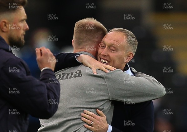 220521 - Swansea City v Barnsley, Sky Bet Championship Play Off Semi Final, Second Leg - Swansea City head coach Steve Cooper embraces coach Alan Tate on the final whistle as Swansea beat Barnsley to reach the Championship Play Off Final